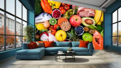 Background healthy food. Fresh fruits, vegetables, meat and fish on table. Healthy food, diet and healthy life concept. Top view Wall mural