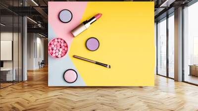 makeup products and decorative cosmetics on color background flat lay. fashion and beauty blogging c Wall mural