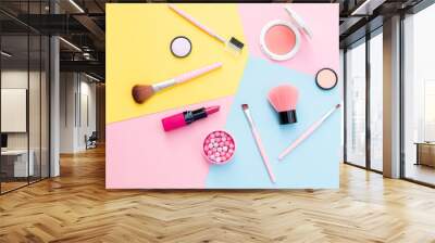 Makeup products and decorative cosmetics on color background flat lay. Fashion and beauty blogging concept Wall mural