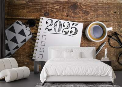 New year resolutions 2025 on desk. 2025 goals list with notebook, coffee cup on wooden table. Resolutions, plan, goals, action, checklist, idea concept. New Year 2025 resolutions, copy space Wall mural