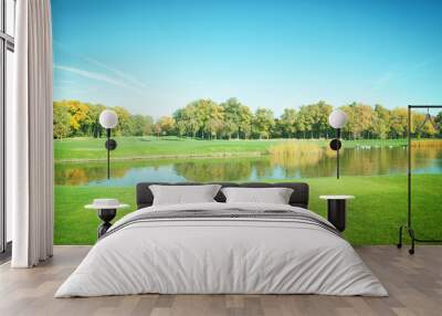 Autumn Landscape. Park in Autumn. The bright colors of autumn in the park by the lake. Wall mural