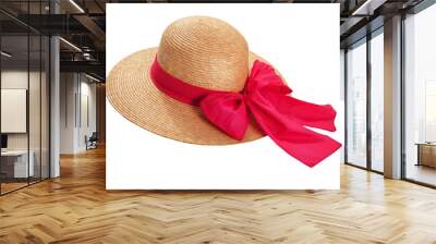 Pretty straw hat with ribbon and bow on white background. Beach hat top view isolated Wall mural