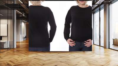 Shirt design and fashion concept. Woman in black sweatshirt front and rear, black hoodies, blank isolated on white background Wall mural