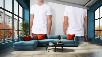 Shirt design and people concept - close up of young man in blank white t-shirt isolated. Wall mural