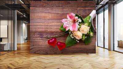 Wedding bridal bouquet of roses and lilies on wooden table Wall mural