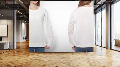 young woman in white sweatshirt, white hoodies front and rear. grey background Wall mural