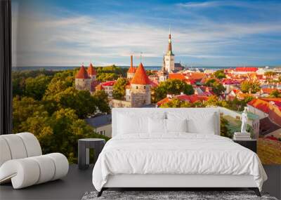 Scenic Tallinn summer cityscape with Saint Olav's church and old town walls and towers at sunset, Estonia Wall mural