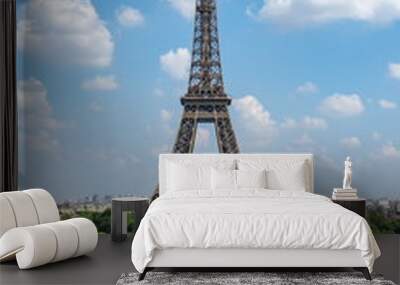 Young couple admiring view of Eiffel tower, Paris, France Wall mural