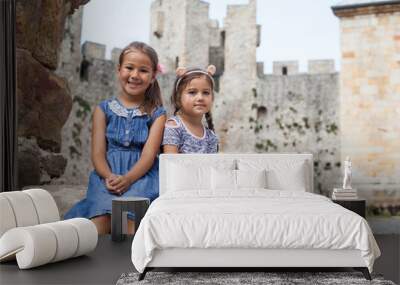 Two little girl at historic location Wall mural