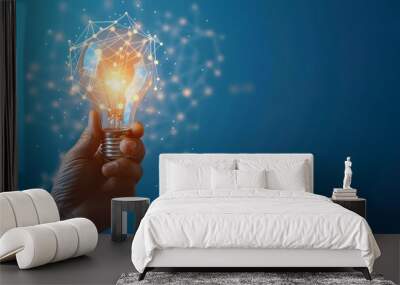 Innovative idea in businessman hand , Hand holding light bulb with glowing digital network Wall mural