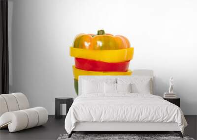 Sliced red, green and yellow paprikas like vegetable burger. Horizontal composition on white background, minimal healthy nutrition concept Wall mural