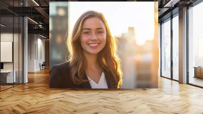 A young woman in a brightly lit urban setting, wearing casual business attire Wall mural