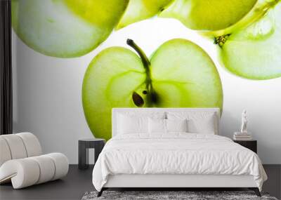 Slices of apple at the backlight isolated on a white background, macro photo Wall mural