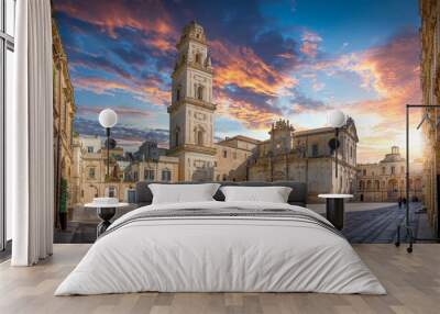 Panorama of Lecce, Puglia, Italy at sunset. Piazza del Duomo square, Campanile tower and Virgin Mary Cathedral (Basilica di Santa Maria Assunta in Cielo), Caritas Diocesana. Baroque city of Apulia Wall mural