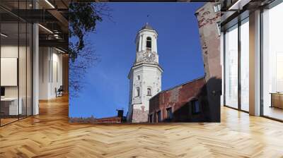 Clock tower in Vyborg, Russia. Cityscape with old stone houses in the historic center. Wall mural