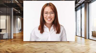 Close-up portrait successful smiling young asian woman in glasses, looking at camera, showing happy emotions, friendly attitude, face of polite customer support office lady, white background Wall mural