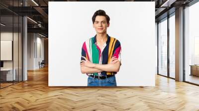 Image of happy good-looking young man cross arms on chest, smiling pleased at camera, standing over white background Wall mural