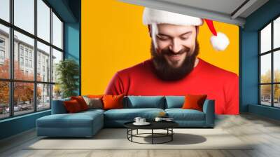 handsome man in a Santa hat with a phone in his hands yellow background, advertising banner, web banner, Place for your text, copy space, empty space, Generative AI Wall mural