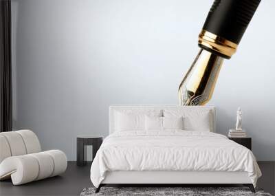 golden fountain pen writes on a white background Wall mural