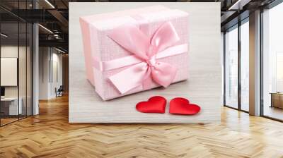 pink gift box with two textile heart shapes Wall mural