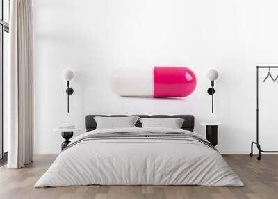 Capsule pills white and pink isolated on white background Wall mural