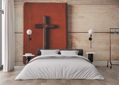 Christian cross with the holy bible on wooden , Vintage Christian Cross, Concept of hope , christianity , faith, religion and church online. Wall mural