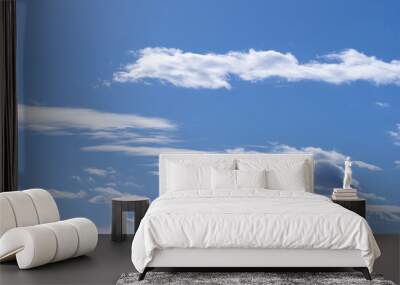 Photograph of the blue sky with clouds on a summer afternoon.
 Wall mural