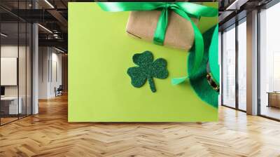 St.Patrick 's Day. celebration. green leprechaun hat and gift box on a bright green background. top view Wall mural