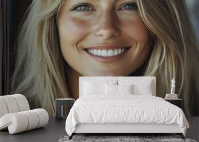 Woman with blonde hair smiling Wall mural