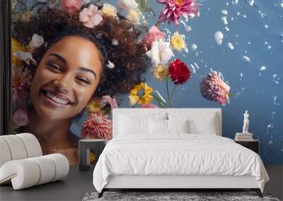 Portrait of a young, smiling woman lying in shallow water with floating flowers. Skin care beauty, skincare cosmetics, spa concept. copy space. Wall mural