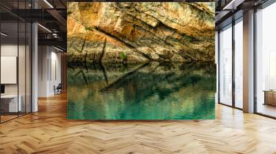 Reflection of stone creates an interesting sign effect in the water. Wall mural