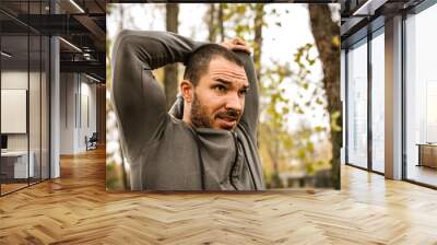 Sporty man in park. Wall mural