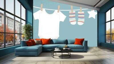 Baby boy clothes pinned to a clothesline, in a cut paper style with textures
 Wall mural