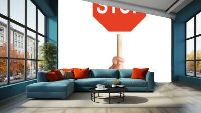 Hand holding stop sign on blank background Wall mural