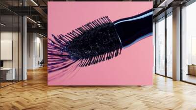 Depict a close-up of the mascara wand with its brush or applicator, showcasing its design and how it deposits the product onto the lashes. Include details about the brus shape and bristle arrangement Wall mural