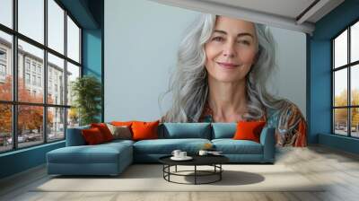 Beautiful woman with grey hair smiling posing on grey background. Wall mural