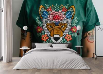 Woman Wearing a Green T-Shirt with a Colorful Wolf Design. Wall mural