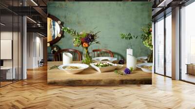 Food on table with flowers Wall mural