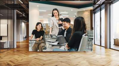 University College instructors and advisors meet female college students to advise their research study. University in classroom campus, college professor teacher and asian students discuss, teamwork  Wall mural