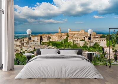 Aerial summer day view of Montepulciano town, located on top of a limestone ridge surrounded by vineyards. Vino Nobile wine territory, known worldwide for its wine and food tours. Wall mural