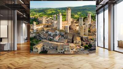 Aerial view of famous medieval San Gimignano hill town with its skyline of medieval towers, including the stone Torre Grossa. UNESCO World Heritage Site. Wall mural