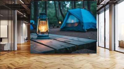 Camping acetylene lantern on wooden table with blurred background in camping area at natural parkland. Wall mural