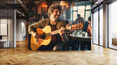 Cheerful musician performing in a pub. Performer playing a guitar. People gathering in the background. Wall mural