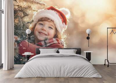 Cute little child hugging Christmas tree in a forest on winter evening. Celebrating festive season with family and friends. Wall mural