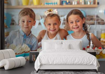 Group of cheerful happy kids in front of birthday party dessert table. Pastel colored birthday cupcakes and sweets decorated with colorful frosting. Wall mural