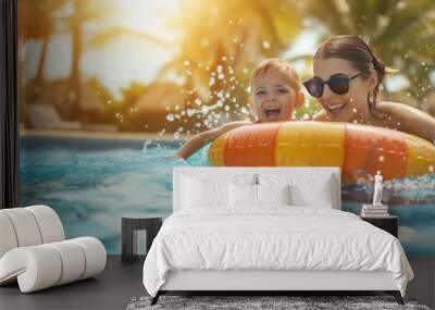 Mother and child playing in swimming pool with colorful floating toy. Little child having fun on family summer vacation in tropical resort. Beach and water toys. Wall mural