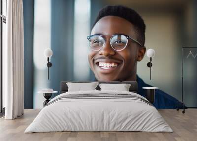 Portrait of an attractive young man wearing eyeglasses. Head shot of smiling person wearing glasses. Wall mural