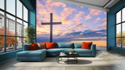 Cross on a mountain top with beautiful sunset sky Wall mural