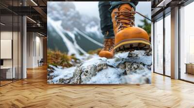 Man hiking up mountain trail close-up of leather hiking boots  Wall mural