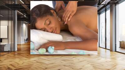 African-American woman getting massage in spa Wall mural